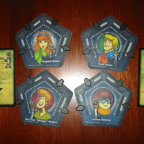 Homemade Character Cards and Scooby Doo Clue pawns for Scooby Doo-based variant of Betrayal.