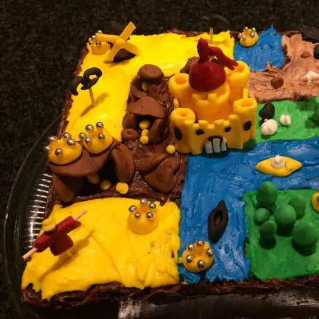 My Kingdomino birthday cake. Yes, it does score my age ;-) My wife did the icing, my daughter did the dragon, and my son arranged the tile configuration. Best cake ever!