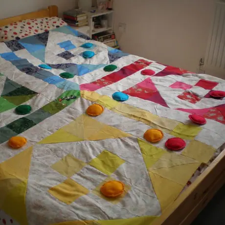 I found this design in a book of games we have and thought - this looks exactly like a quilt! So I made this about 2 years ago. All fabrics are re-purposed. Sadly, it's not ready yet - I have to get some batting and backing fabric. And a big soft die. :)