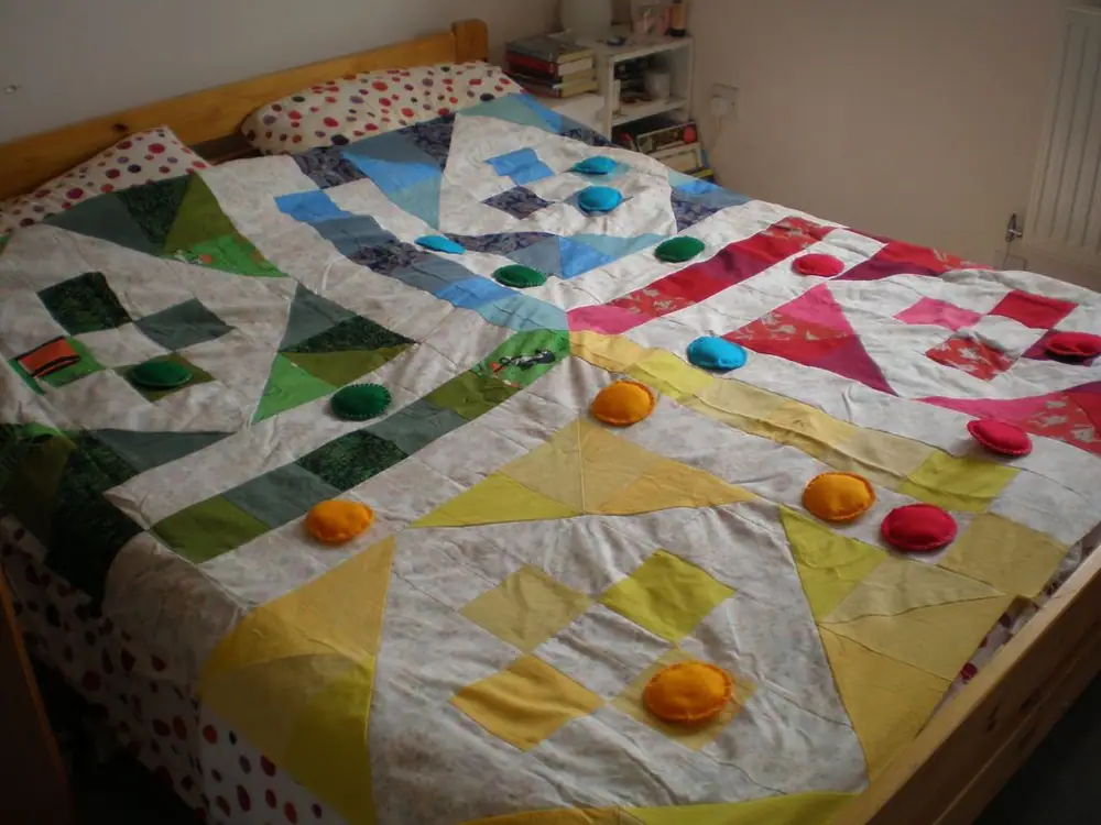 I found this design in a book of games we have and thought - this looks exactly like a quilt! So I made this about 2 years ago. All fabrics are re-purposed. Sadly, it's not ready yet - I have to get some batting and backing fabric. And a big soft die. :)