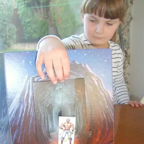 Charlotte demonstrates my prototype for a drop-down 'King of Thieves' prop - adds a smidgen more theatre for family games of SidiBaba.