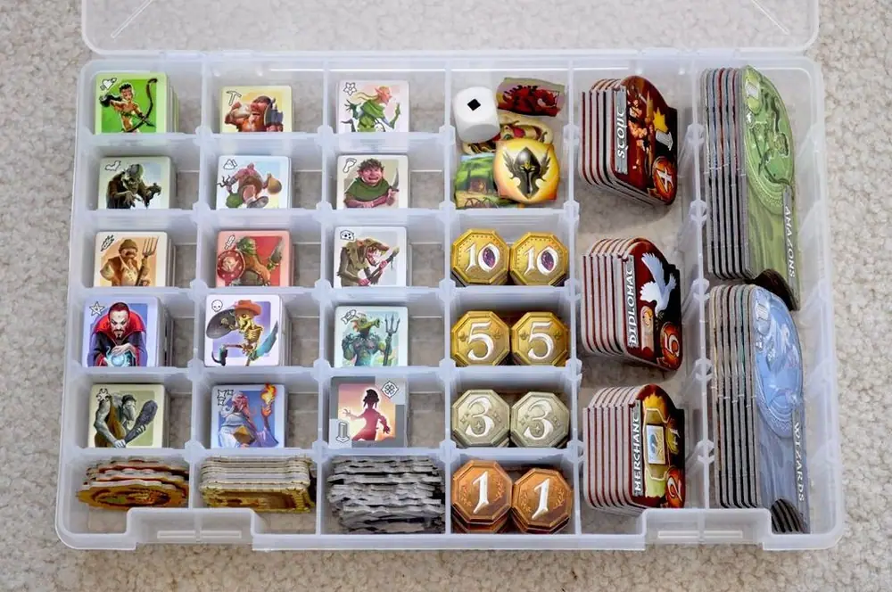 Storage solution for Small World:  a Plano 3600 box.  Holds EVERY COUNTER in the game, except the Mountain tiles (which are hardly necessary and easily stored separately in the game box).