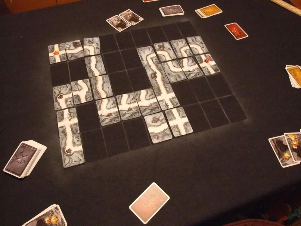 I saw a need for a play mat for the game to ease setup and play.  I found a suitable cloth of polar-fleece material, laid out a grid pattern of standard cheap playing cards, and using a white aerosol spray paint I lightly dusted over the cards leaving thi